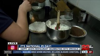 Topping pies for Pi Day at Happy Jack's