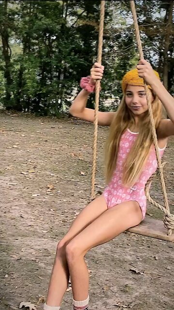 Swinging and smiling