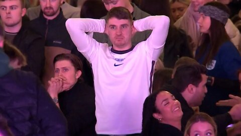 England fans in Sefton Park in Liverpool react to 1-2 loss to France in World Cup Quarter-Final