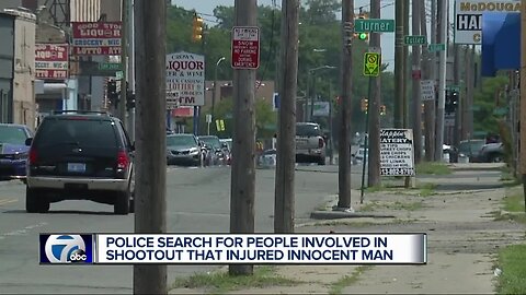 Dad shot after family caught in crossfire of Detroit gun battle