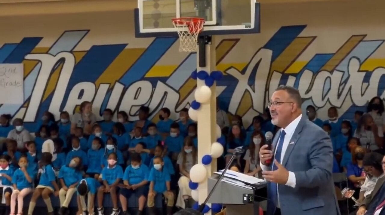 Unmasked Education Secretary Speaks To A Gym Full Of Masked Kids