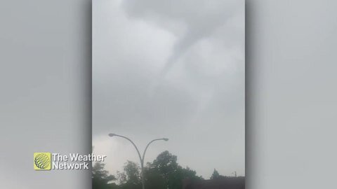 Small funnel forms in the sky on a rainy day