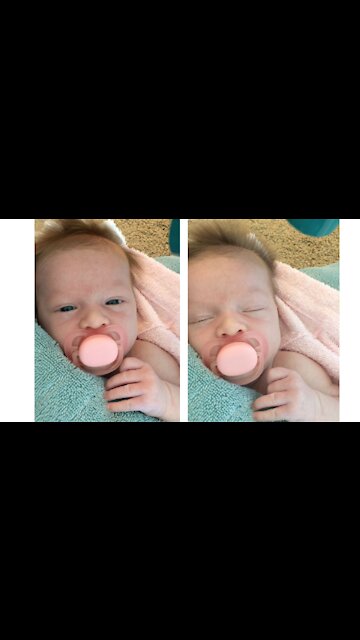 Adorable baby girl loves having her hair dried