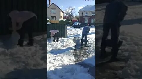 shoveling snow in front garden