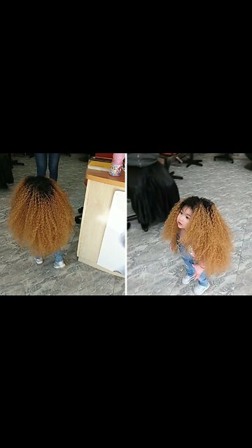 The little doll with long curly hair enchanted everyone with her beauty.