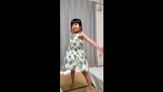 Little girl dancing to her own tune