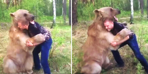 Guy Plays With a Bear