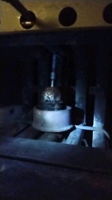 Waste oil burner unit installed in fireplace insert