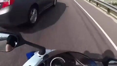 Motorcyclist Almost Sees The Pearly Gates When A Car Almost Sends Him Flying Off An Overpass