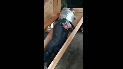 Ukrainian "soldiers" bully a Russian POW