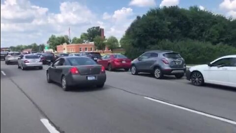 Cars line up to receive free gas in Oak Park