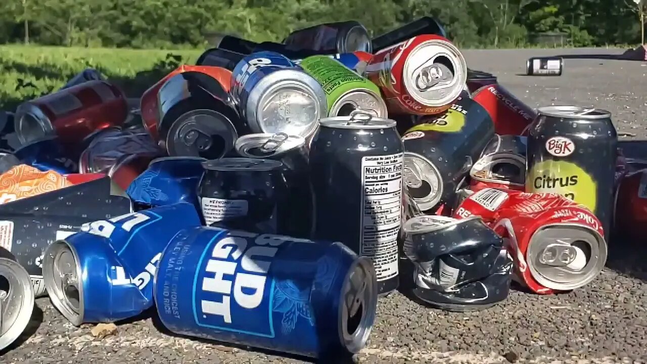 Having fun crushing cans for the next aluminum melt in the furnace