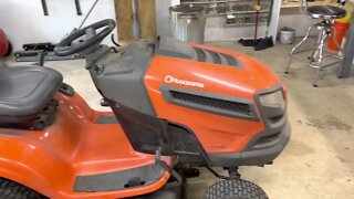 Adjusting a clutch, replacing belt and changing oil, filters on two riding mowers