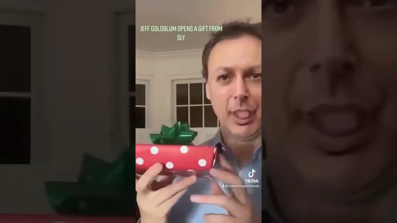 Jeff Goldblum opens a gift from Sly