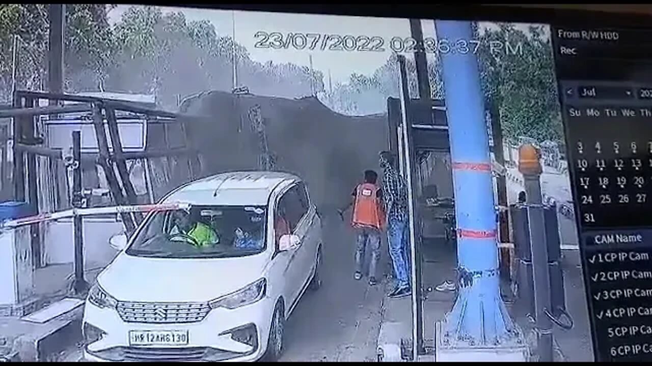 Woman saves toll booth worker from getting crushed by a truck