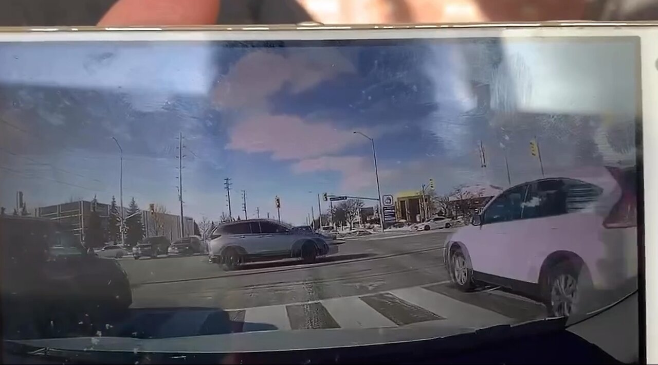 Distracted Driver Runs Red Light