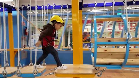 Determined toddler conquers obstacle course