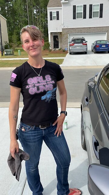 She wasn’t checking out your car, she likes your guns!