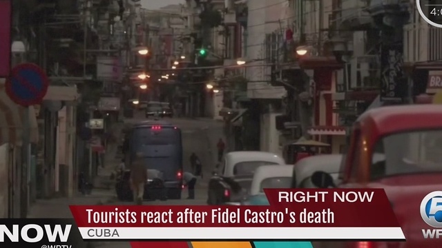 Tourists react after Fidel Castro's death