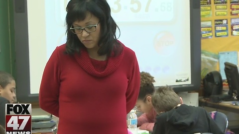 Teachers protest Betsy Devos' confirmation hearing by wearing red