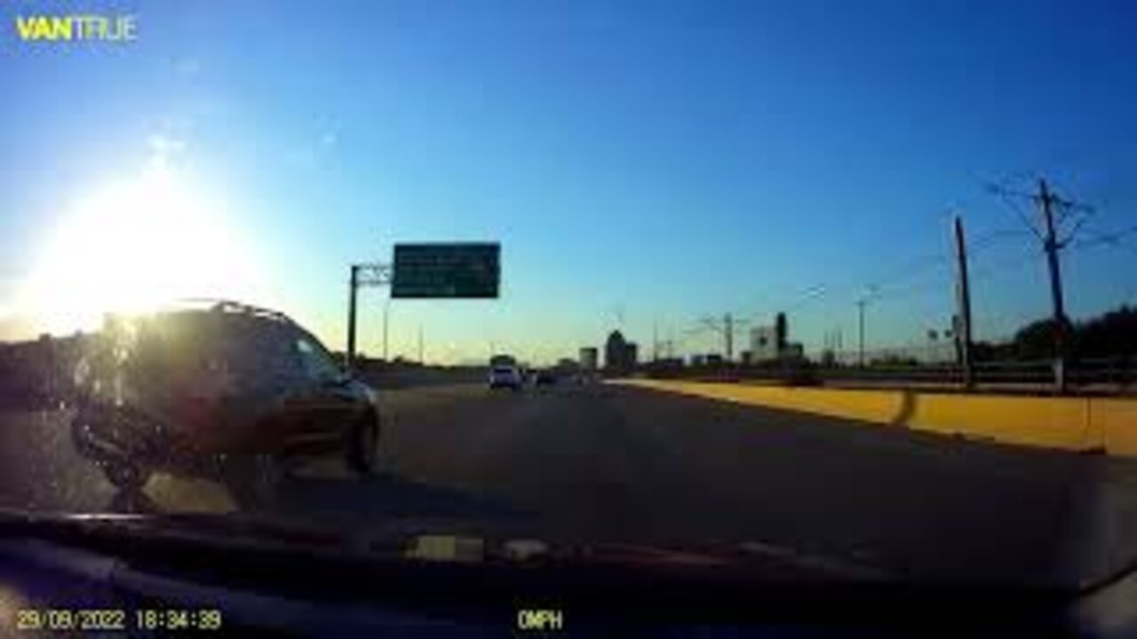 White SUV almost crashes into Black Chevy Tahoe