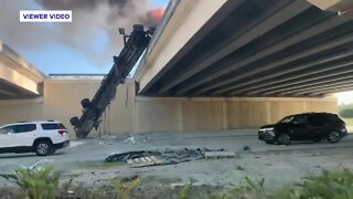 RAW VIDEO: Truck goes off overpass, bursts into flames