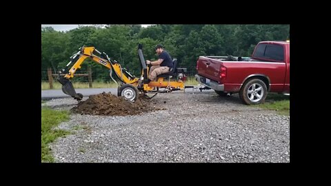 Adding a culvert pipe to the driveway digging it put with my towable backhoe trencher from betstco