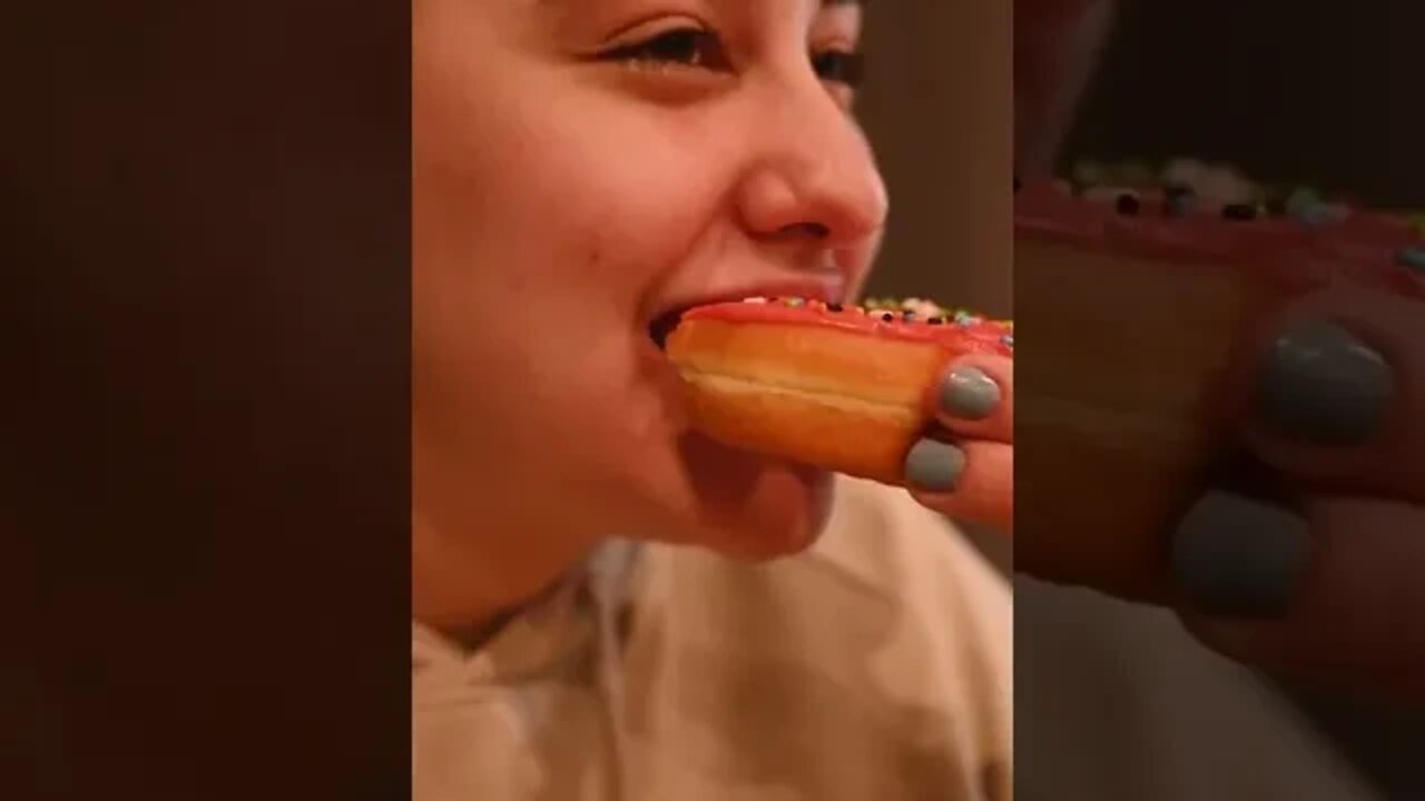 Woman Eating a Donut