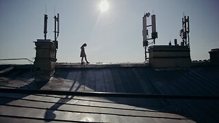 Woman walking on the roof of a house code