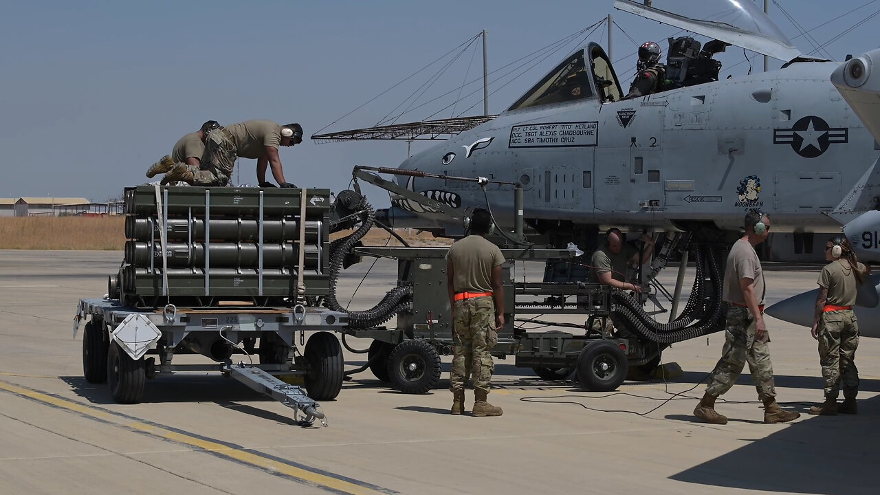 A-10 crew demonstrates loading ammunition