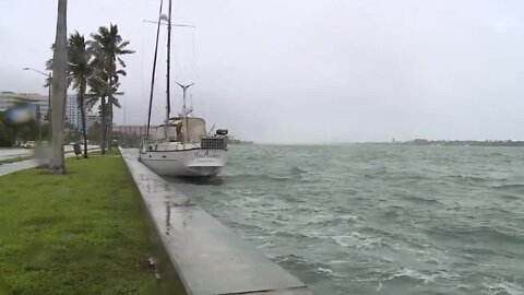 Sailboat drifts, slams against seawall as Nicole brings high tides, strong rip currents