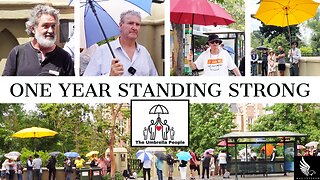 THE UMBRELLA PEOPLE STANDING FOR THE ONE YEAR ANNIVERSARY