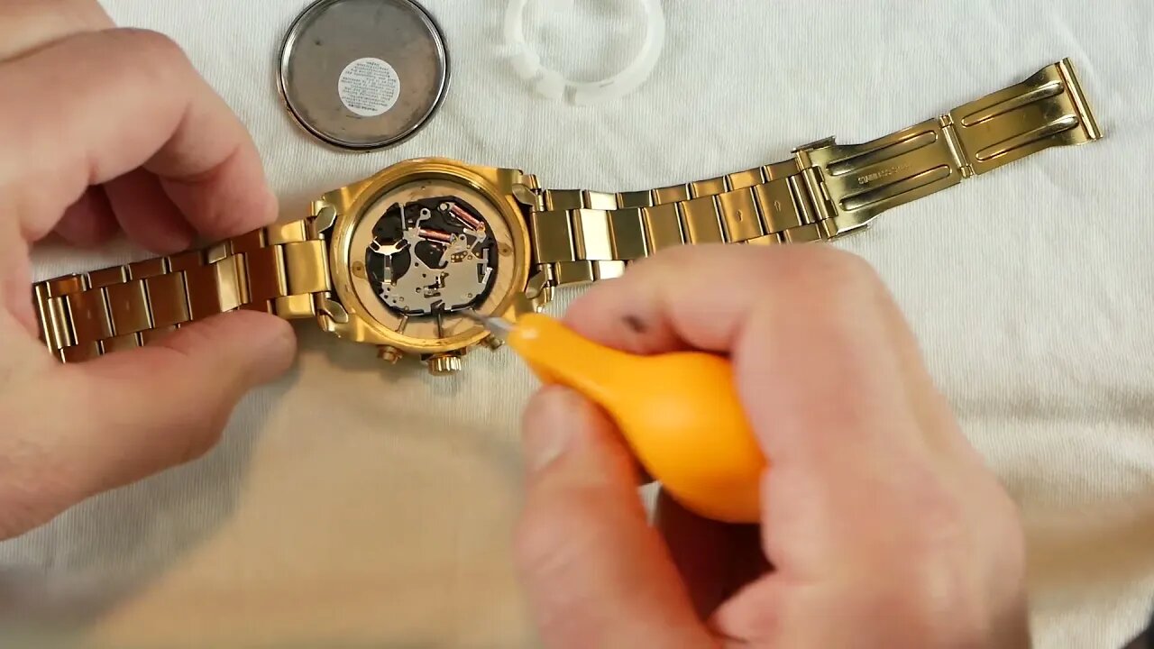 Invicta Watch back removal, battery replacement, crystal cleaning.