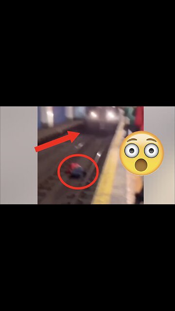 Train Comes Charging at Man Lying on Tracks