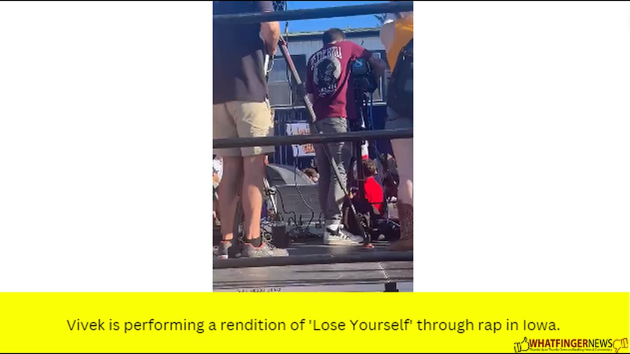 Vivek is performing a rendition of 'Lose Yourself' through rap in Iowa.