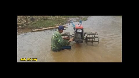 the ddan man has just come back from plowing and washing machines