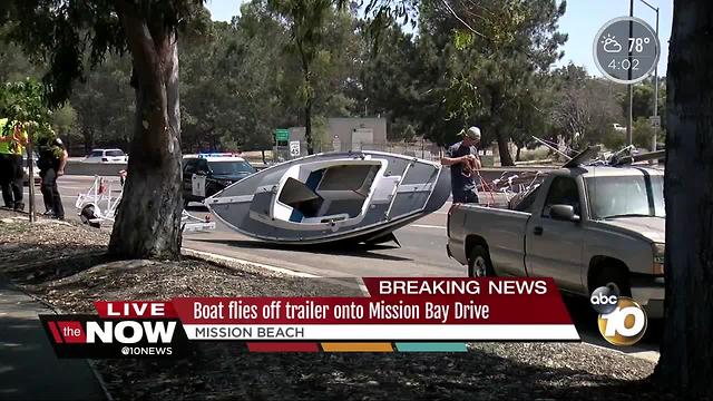 Boat flies off trailer onto Mission Bay Drive