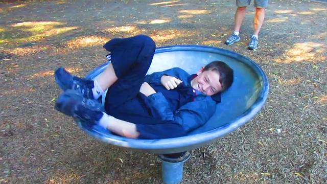 Hilarious Boy Falls Down After Spinning On A Playground Chair