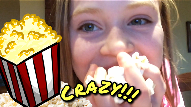 Little girl stuffs her face with popcorn!