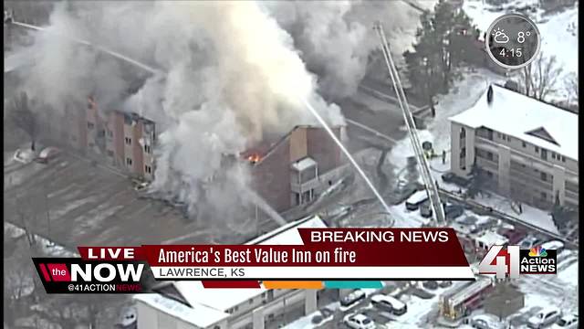 Lawrence fire crews battle motel fire