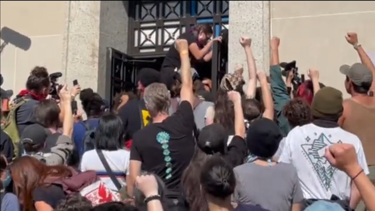 Climate Protesters Try to Push Through Police to Enter Interior Department