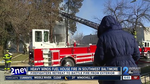 Firefighters battle more than flames during Baltimore house fire