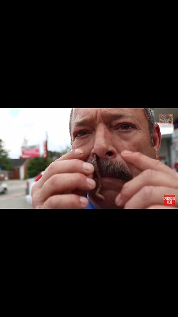 Guy sniffs worm then eats it