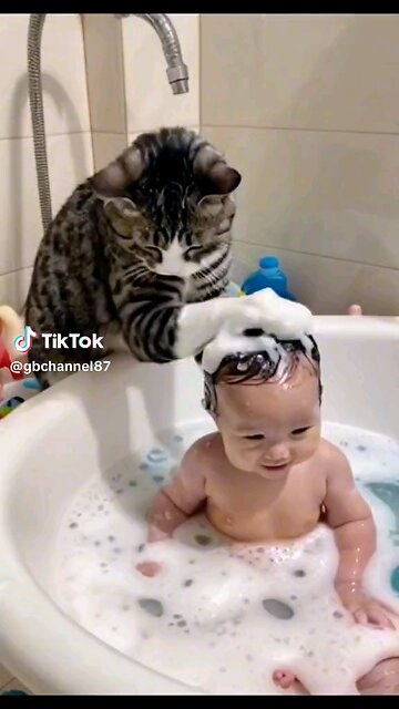Title: "Purr-fect Bath Time" Video Description (VD): "Watch as an adorable cat helps a baby enjoy