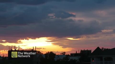 The sun sinks behind the prairie horizon