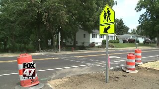 Business owner against sidewalk on his property