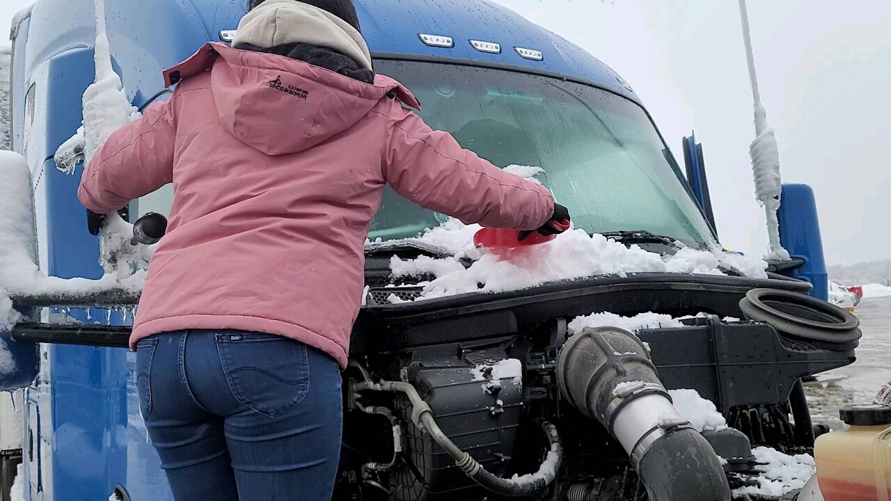 Helping my husband shoveling snow off the truck