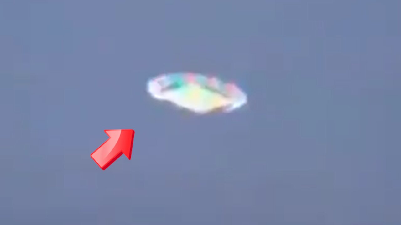 Sighting of a rainbow-colored disc-shaped UFO in the bright sky [Space]