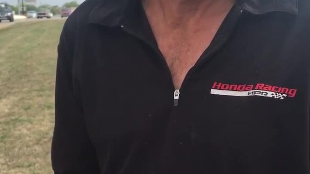 Indianapolis man cleans up west side intersection with leaf blower, smile