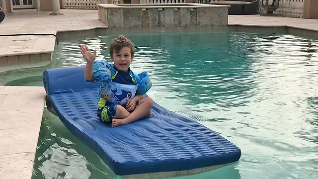 Happy Canadian Boy Goes Boating on a Floatie in Florida Pool